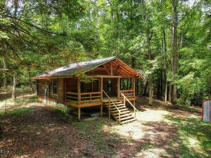 Secluded Log Cabin Retreat on 6.6 Wooded Acres with Creek — A Rare Private Escape in Jamestown