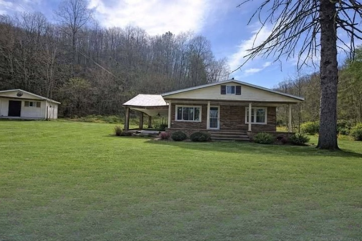 Charming Brick Home on Nearly Seven Acres with Creek Frontage – Seller Financing Available