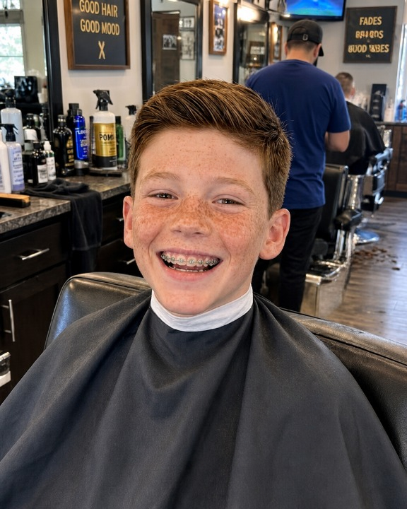 “My nine-year-old son’s barber leaned toward….